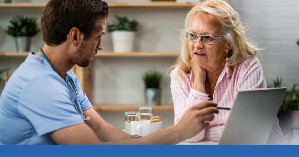 a man and woman looking at a laptop