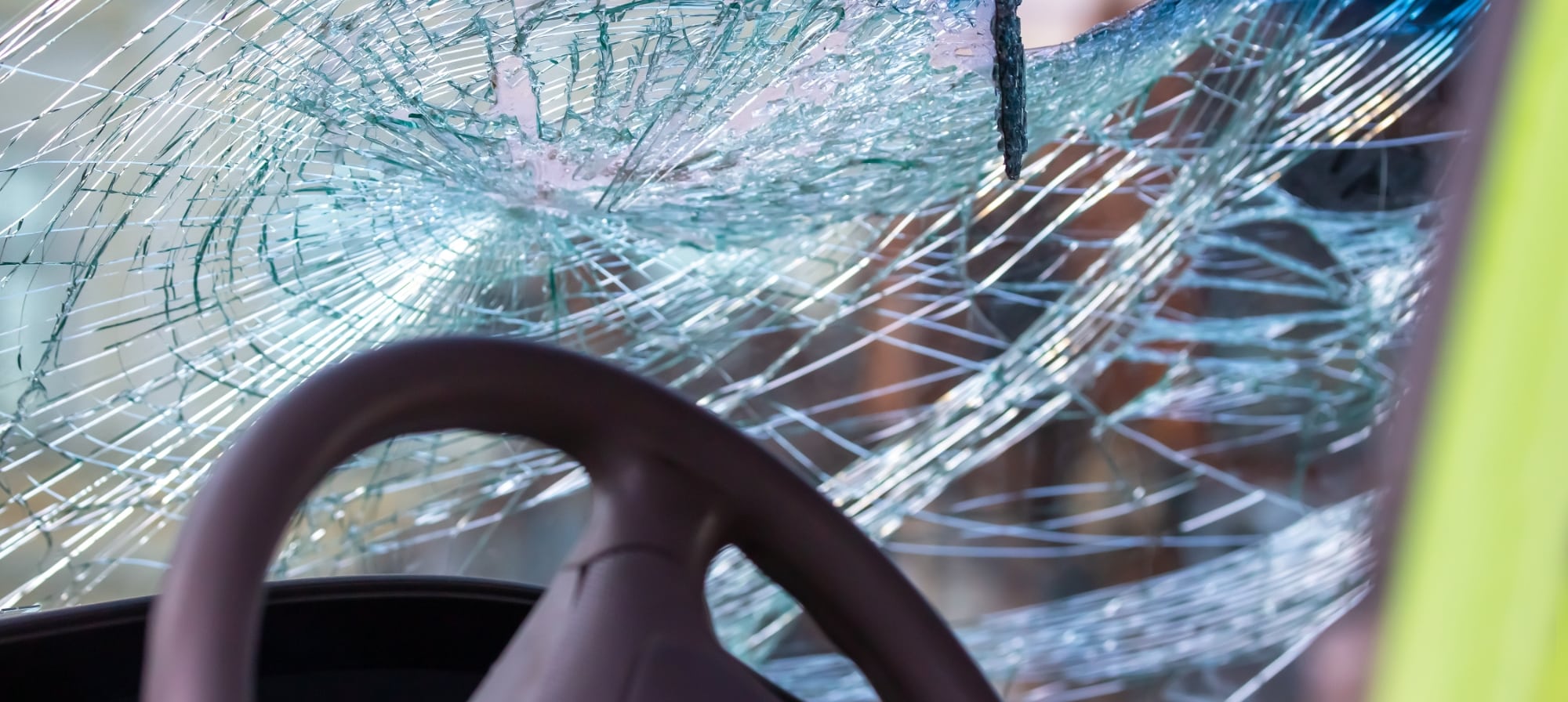 The windshield of a vehicle smashed after an accident.
