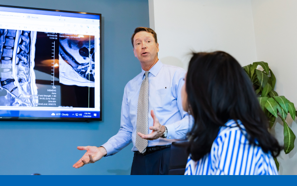 Tom Crosley presenting a case to a room of people.
