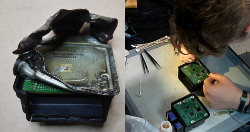 A damaged airbag control module and a person inspecting it