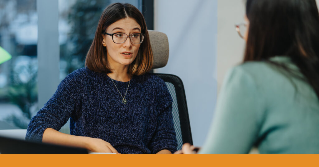 A woman speaking with a legal advisor