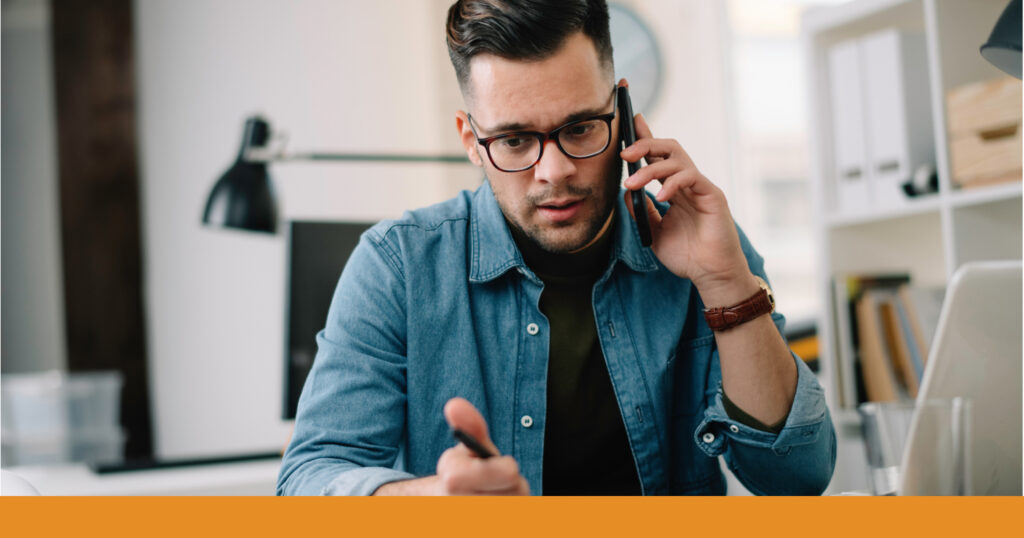 A concerned man speaks on the phone with a personal injury attorney