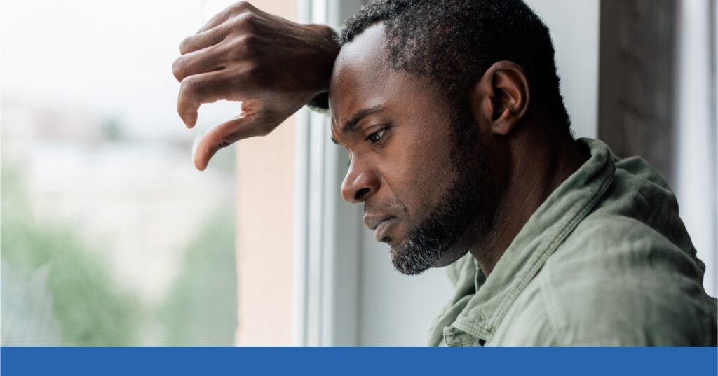 A grieving man looks out the window after losing a loved one in a wrongful death incident in Texas