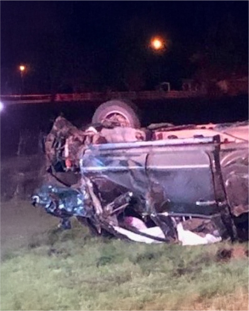 a wrecked car in a field