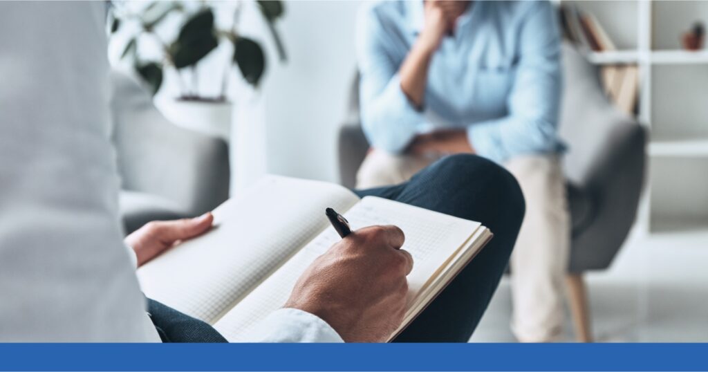 a person writing in a notebook