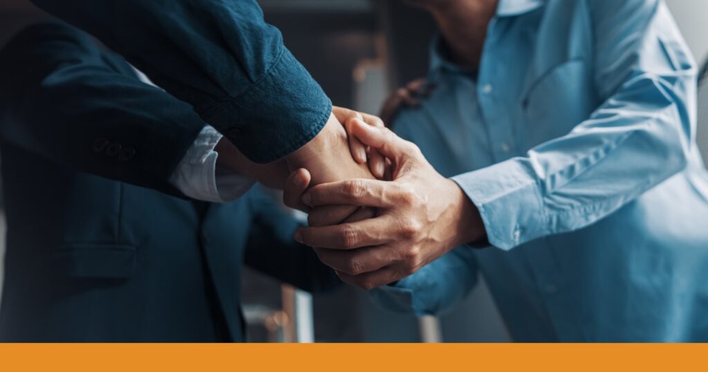 close-up of a handshake with a car accident attorney