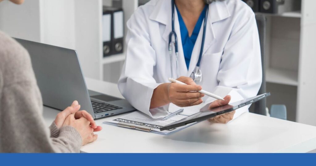 a medical professional showing a client imaging from a tbi-related injury