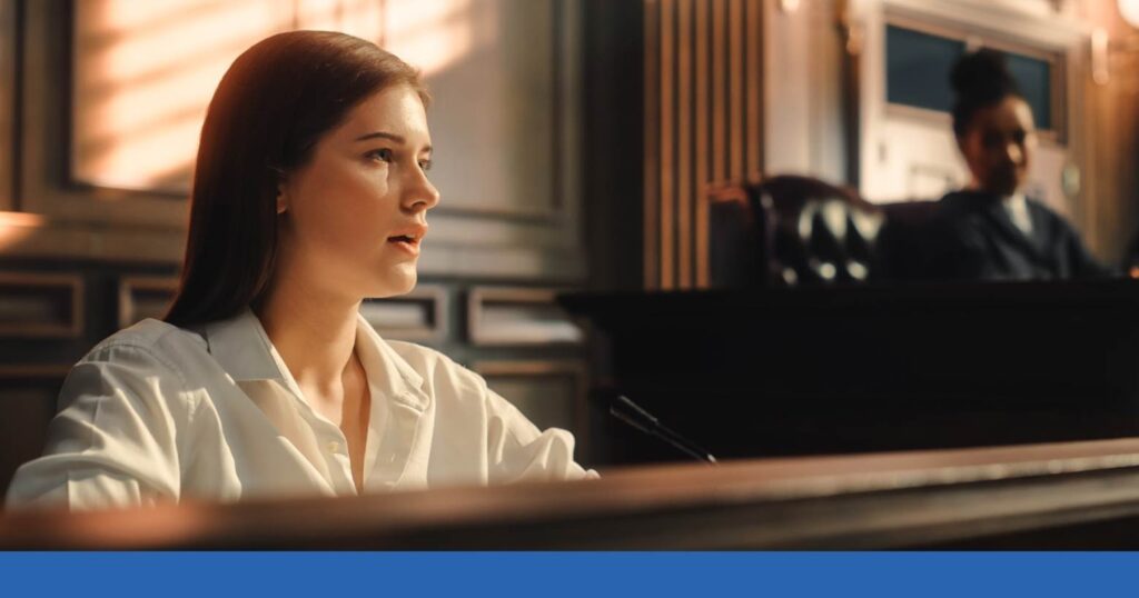 a woman giving testimony in court