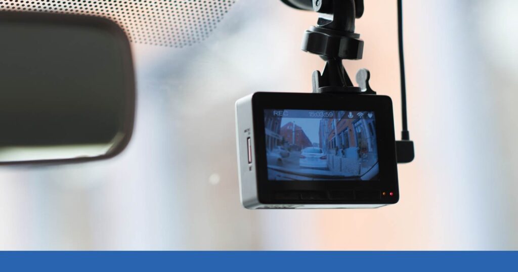 a dashcam in the front window of an automobile