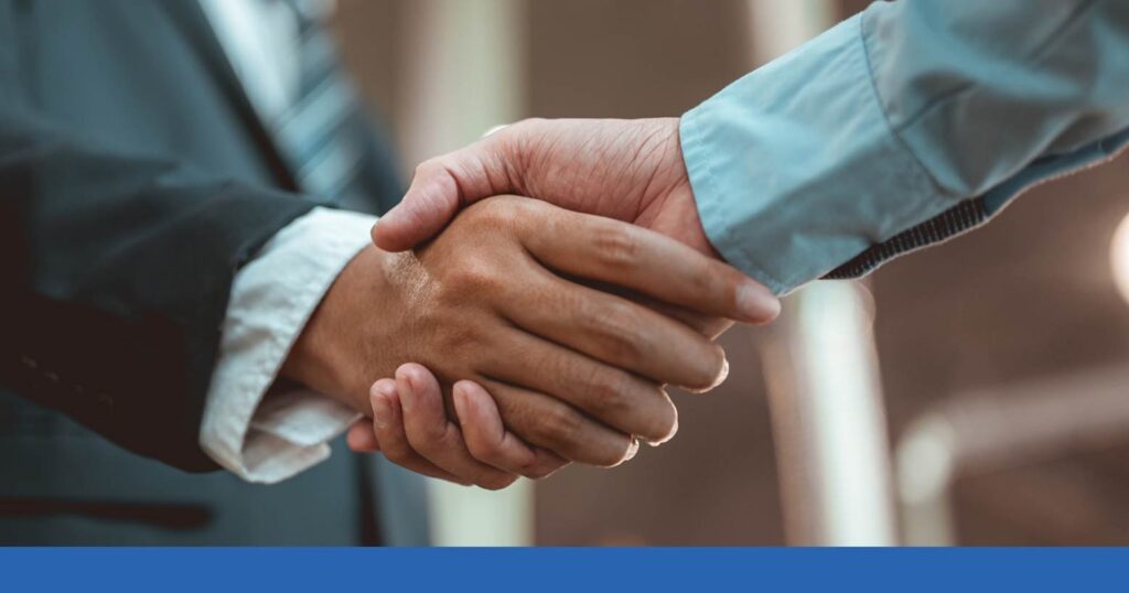 a person shaking hands with a personal injury lawyer