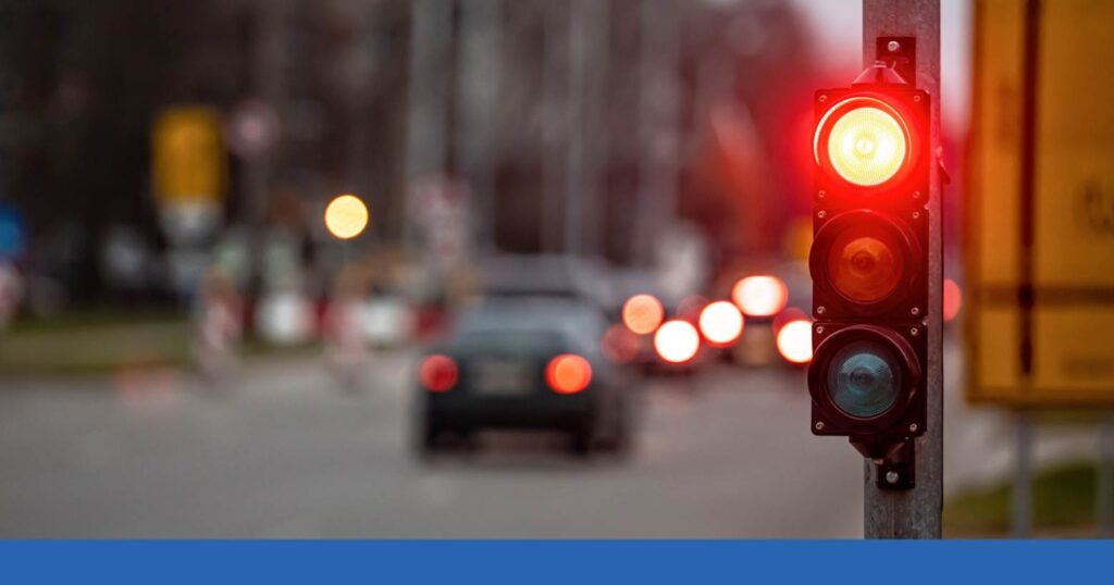 a traffic signal on a busy street