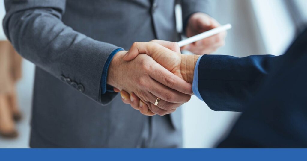 a person shaking hands with an accident lawyer