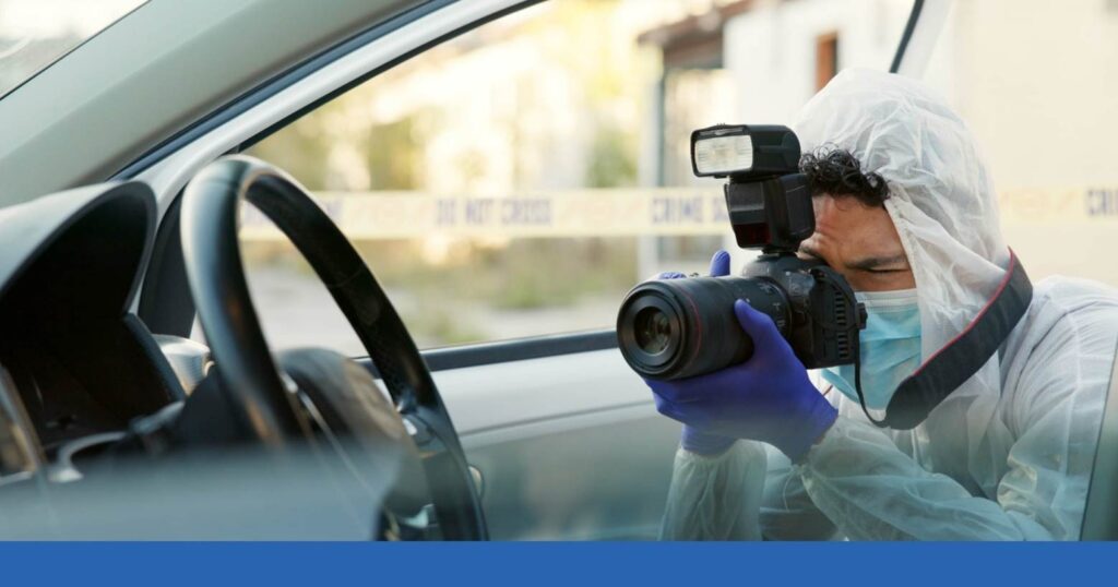 a person photographing evidence after a car crash
