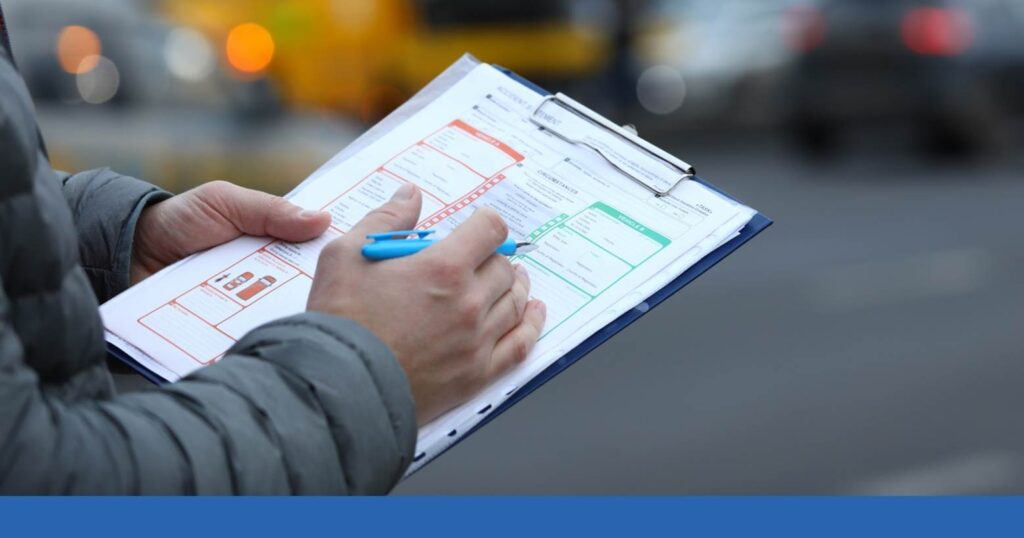a person with a clipboard documenting evidence from a truck accident