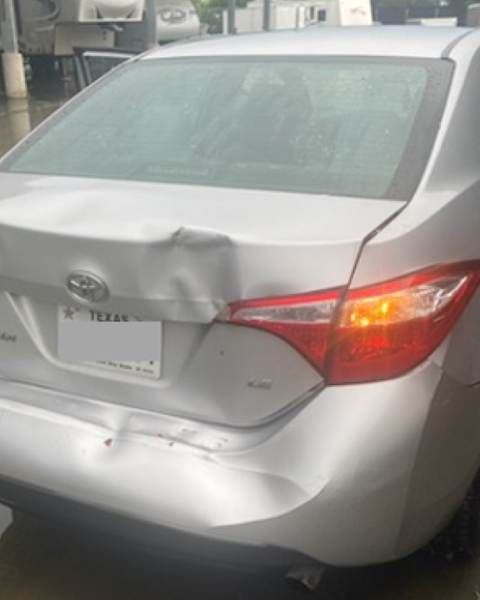a car with rear damage from a truck accident