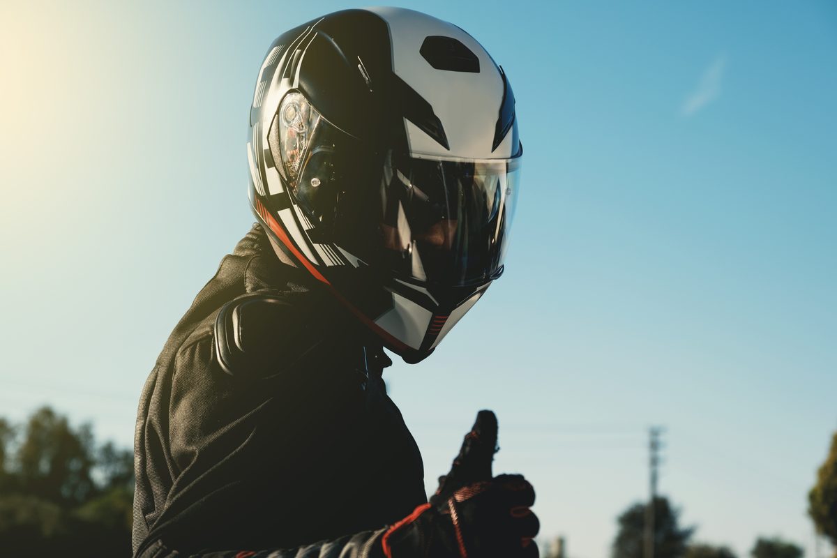 Portrait of a motorcycle rider wearing a protective helmet